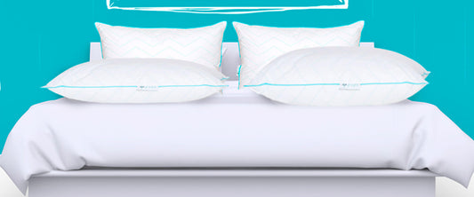 Imagen de una cama con Almohadas Sognare encima.
